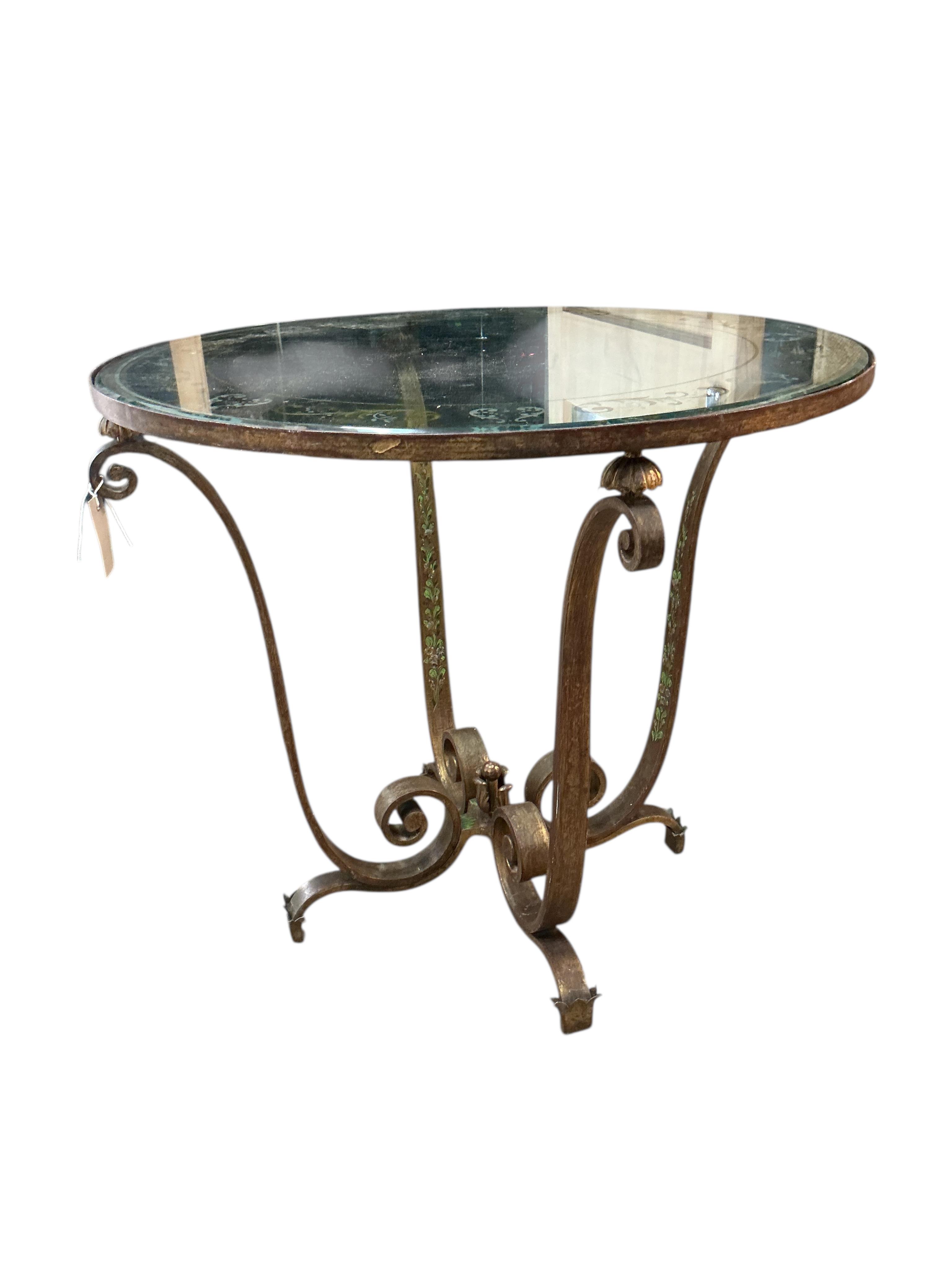 In the manner of Raymond Subes, a circular engraved glass and patinated wrought iron occasional table, diameter 70cm, height 62cm